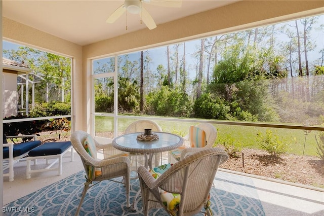 sunroom with a ceiling fan