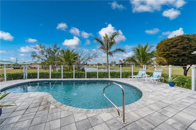 pool with fence and a patio area