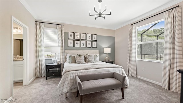 carpeted bedroom featuring an inviting chandelier, crown molding, baseboards, and ensuite bathroom