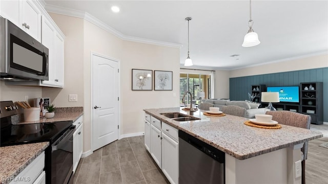 kitchen featuring appliances with stainless steel finishes, white cabinetry, crown molding, and a sink