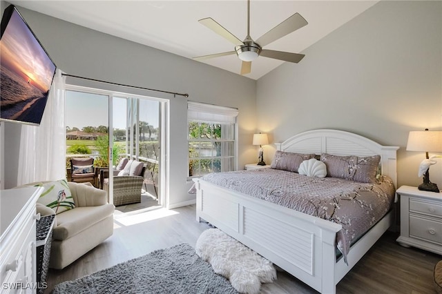 bedroom featuring vaulted ceiling, wood finished floors, ceiling fan, and access to outside