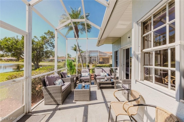 sunroom / solarium with a water view