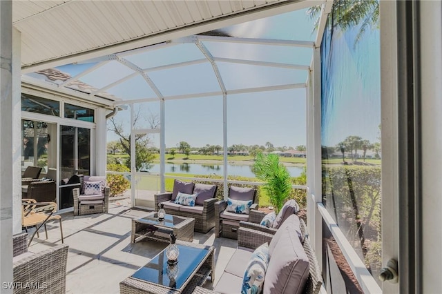 sunroom / solarium featuring a water view