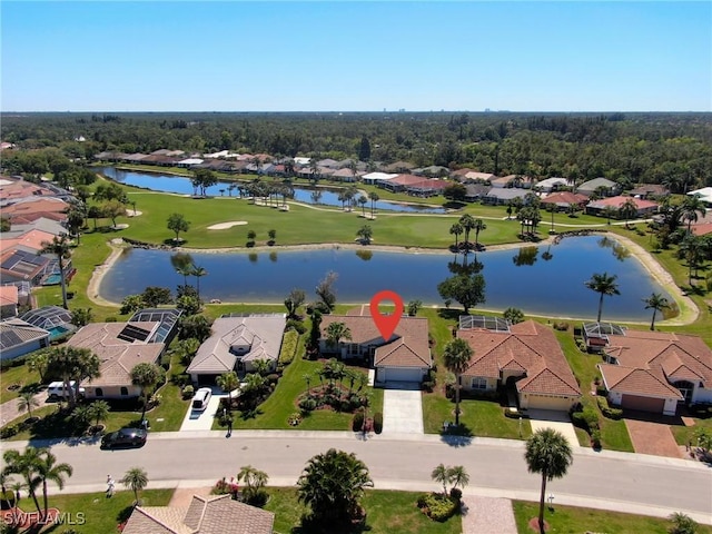 drone / aerial view featuring a residential view and a water view