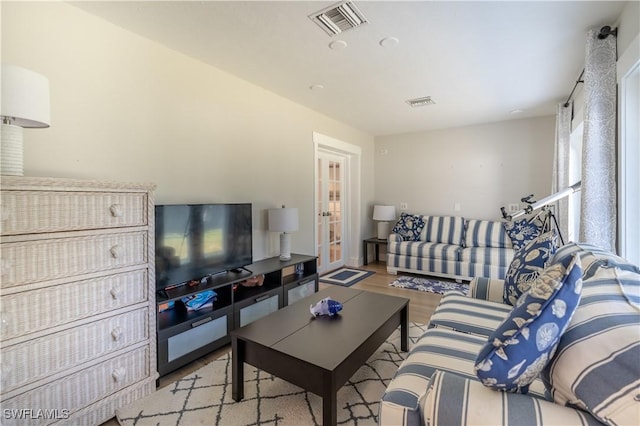 2237 Kings Lake Blvd, Naples, FL 34112 - living room featuring wood finished floors