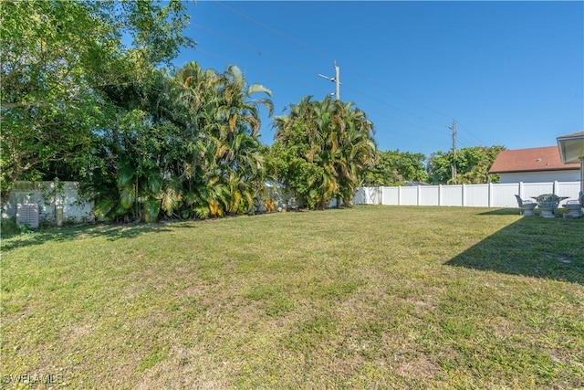 view of yard with a fenced backyard