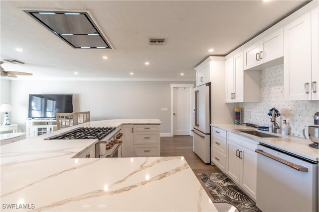 2237 Kings Lake Blvd, Naples, FL 34112 - kitchen with white appliances, a sink, white cabinetry, decorative backsplash, and light stone countertops