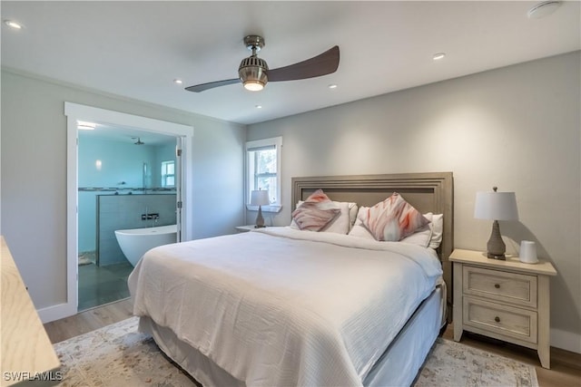 bedroom with recessed lighting, light wood-style flooring, connected bathroom, and ceiling fan