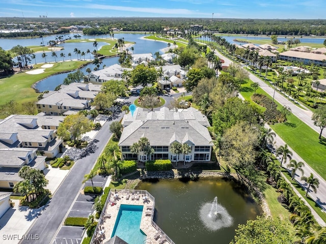 birds eye view of property with a water view and a residential view