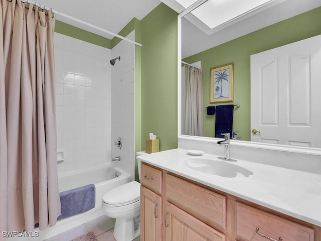 full bath featuring toilet, vanity, a skylight, and shower / tub combo with curtain