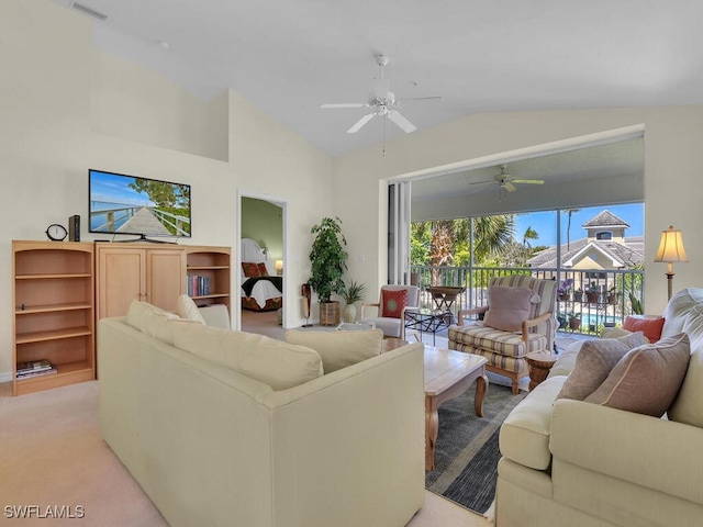 living area with visible vents, light colored carpet, a ceiling fan, and lofted ceiling