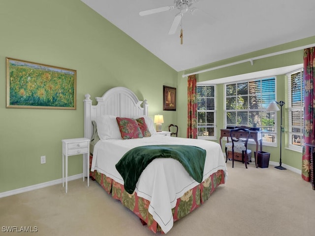 bedroom with baseboards, lofted ceiling, carpet floors, and a ceiling fan