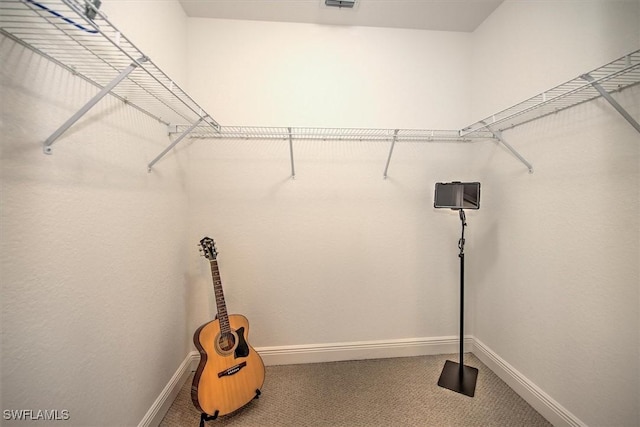 walk in closet featuring carpet and visible vents