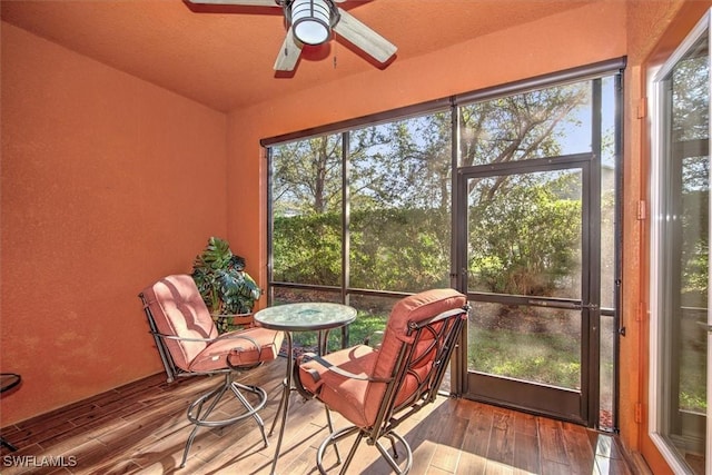 sunroom / solarium with ceiling fan