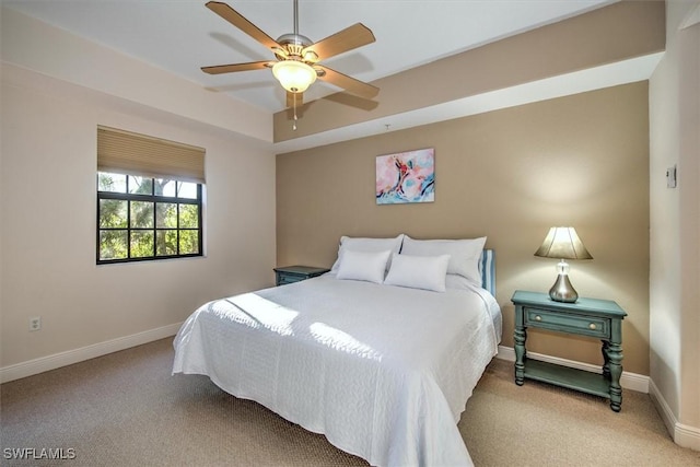 bedroom with carpet flooring, a ceiling fan, and baseboards