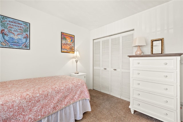 carpeted bedroom featuring a closet