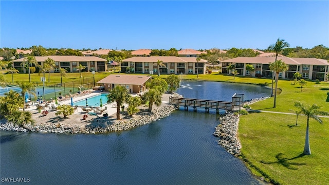 bird's eye view featuring a water view and a residential view