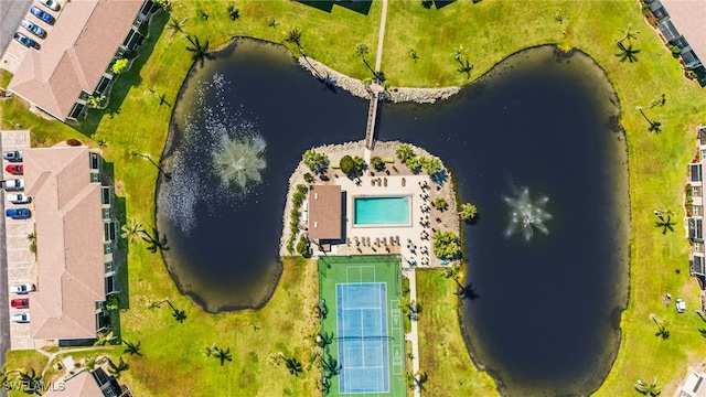 birds eye view of property with a water view