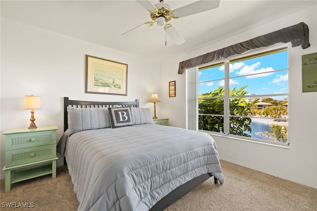 bedroom with ceiling fan and carpet floors