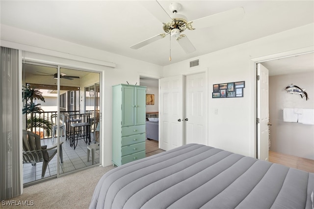 bedroom with a ceiling fan, access to outside, light colored carpet, and visible vents