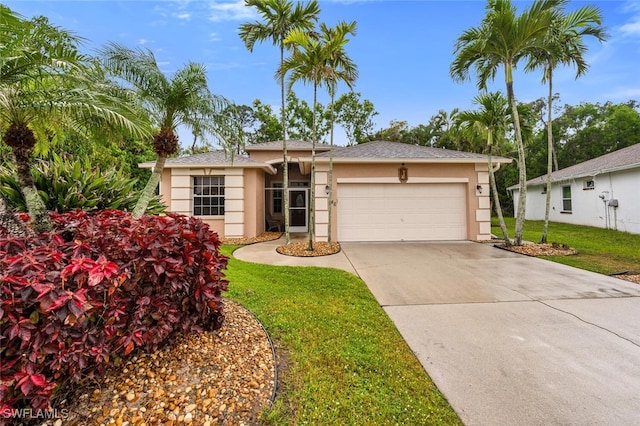 view of front of home with stucco siding, a front lawn, concrete driveway, and an attached garage