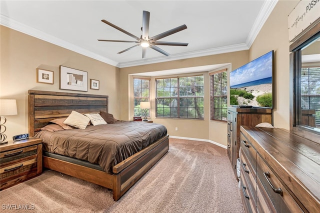 bedroom featuring carpet flooring, baseboards, ceiling fan, and crown molding