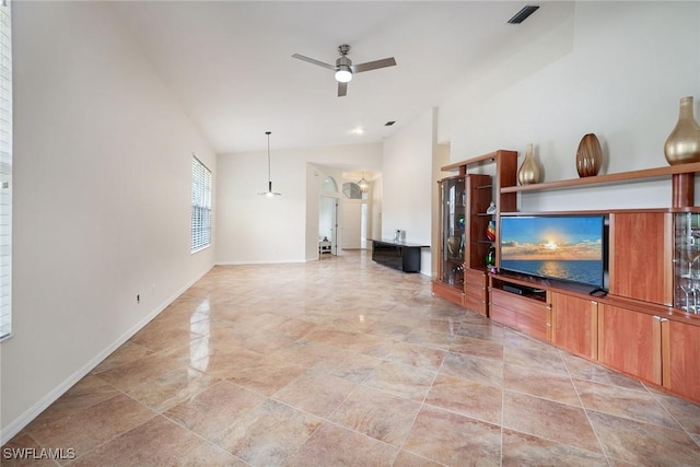 living area featuring visible vents, baseboards, ceiling fan, and high vaulted ceiling