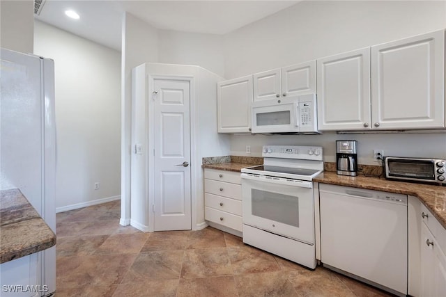 kitchen featuring white appliances, baseboards, visible vents, a toaster, and white cabinetry