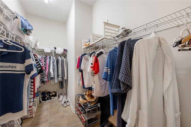 spacious closet featuring tile patterned flooring