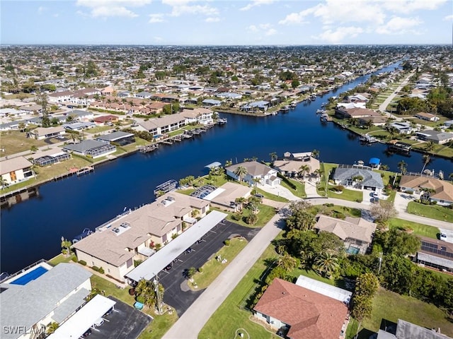 view of property location with nearby suburban area and a large body of water