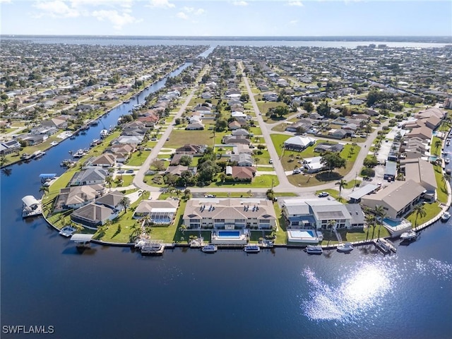 aerial overview of property's location featuring nearby suburban area and a large body of water