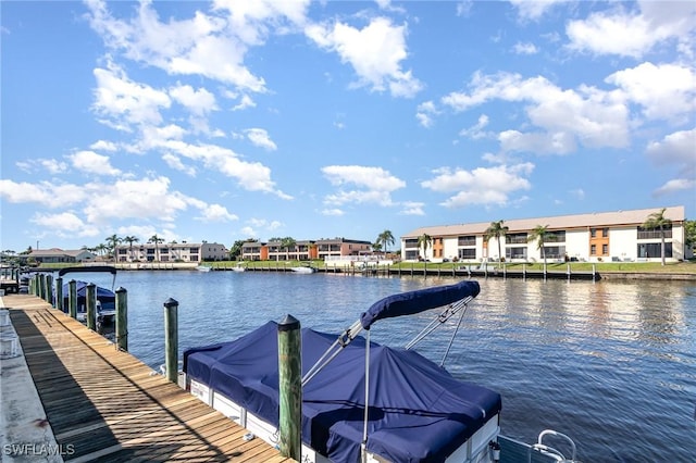 dock featuring a water view and a residential view
