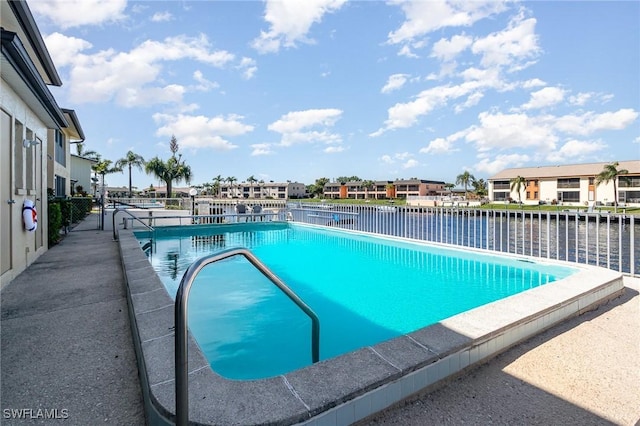 community pool featuring fence