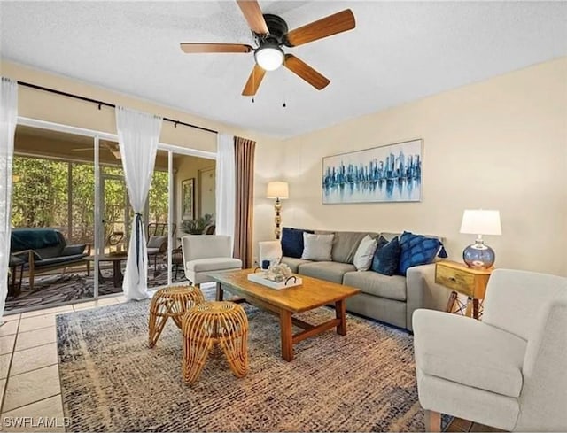 tiled living area with a ceiling fan