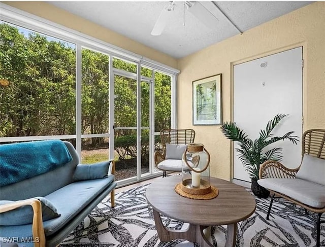 sunroom with a ceiling fan