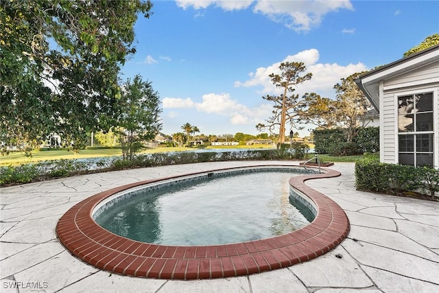 outdoor pool with a patio