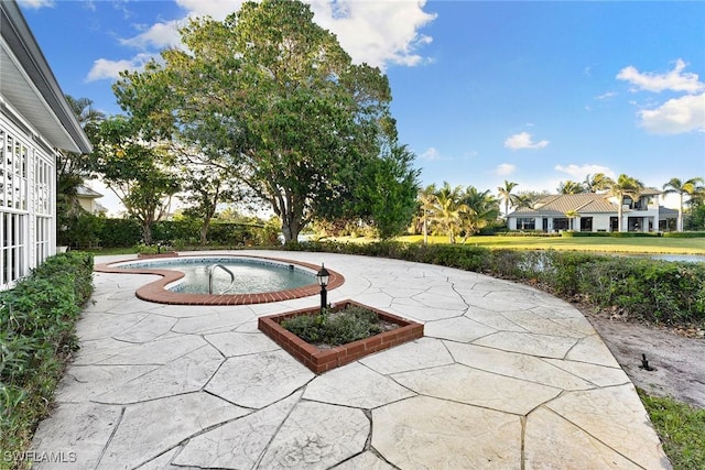 view of patio featuring a pool