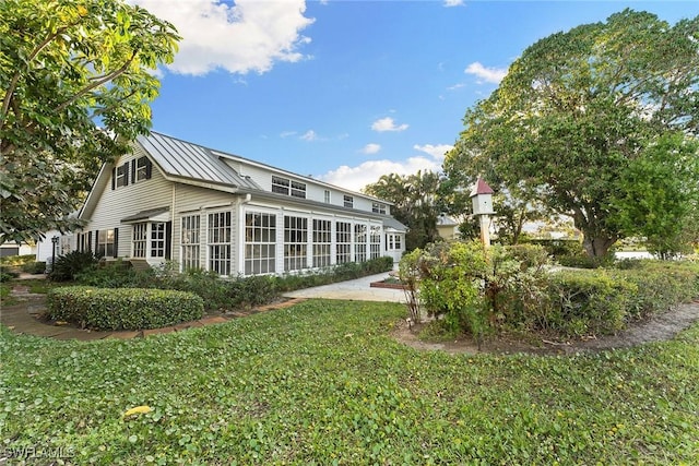 view of community featuring a patio and a yard