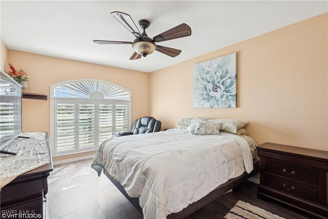 bedroom featuring a ceiling fan and wood finished floors