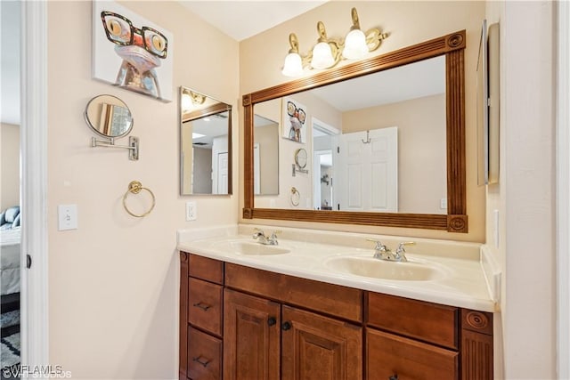 ensuite bathroom with double vanity, ensuite bathroom, and a sink