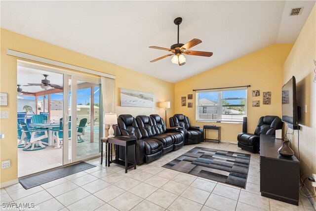 tiled living room featuring visible vents, a ceiling fan, and vaulted ceiling