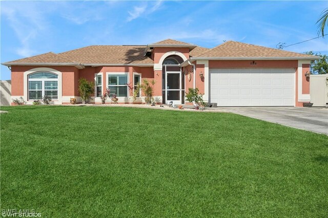 ranch-style house with stucco siding, roof with shingles, concrete driveway, a front yard, and a garage