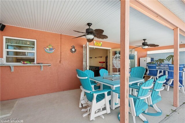 view of patio / terrace with outdoor dining space and a ceiling fan