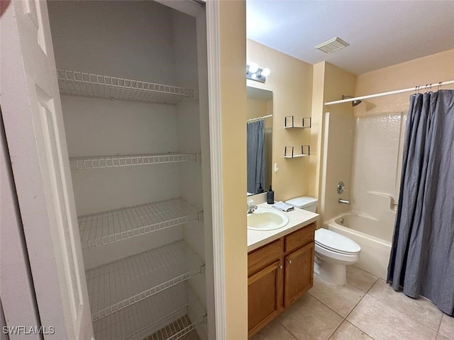 bathroom with tile patterned flooring, visible vents, toilet, shower / tub combo, and vanity