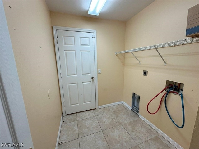 laundry room featuring hookup for a washing machine, light tile patterned floors, baseboards, laundry area, and electric dryer hookup