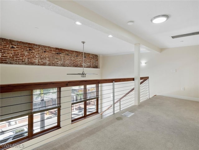 carpeted spare room with recessed lighting, beamed ceiling, and visible vents