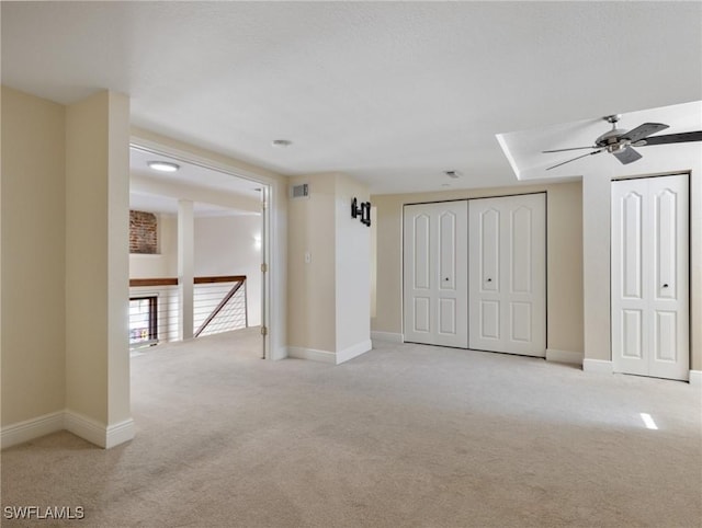 unfurnished bedroom featuring visible vents, baseboards, and carpet floors