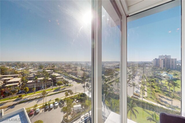 unfurnished sunroom with a city view