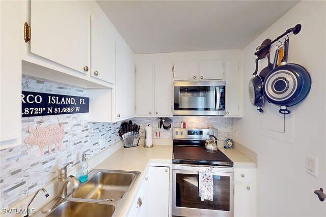 kitchen featuring a sink, light countertops, backsplash, and stainless steel appliances