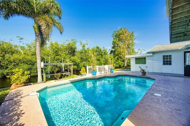 pool featuring a patio area